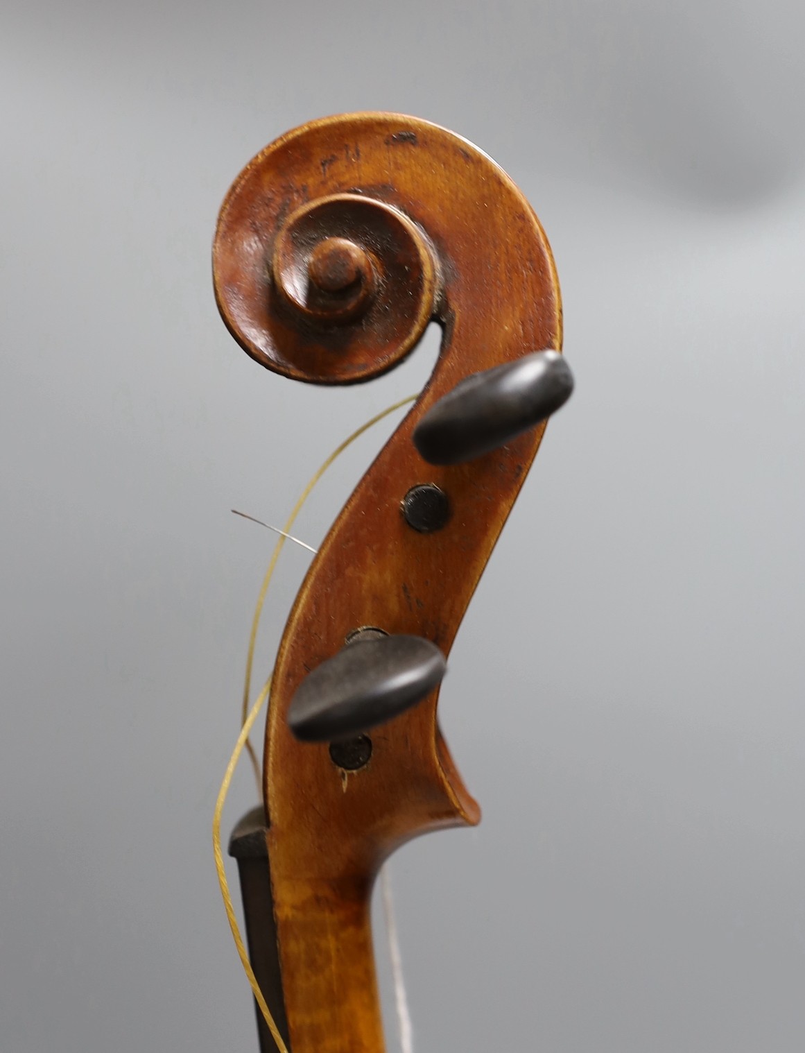 A cased 19th century violin, labelled Stradivarius 1690, with a Dodd bow